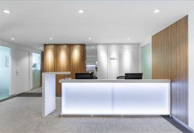 Modern reception desk with bright integrated LED lighting.