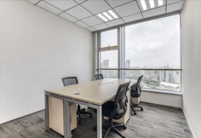 Small three-person office suite with city views and glass partitions.