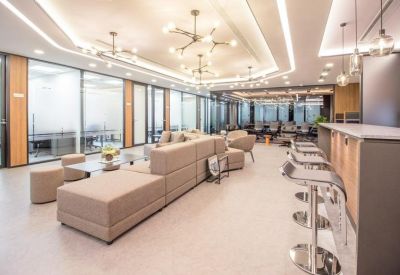 Open lounge space with seating and high stools.