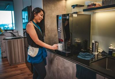 Modern office pantry featuring a premium bean-to-cup coffee machine.