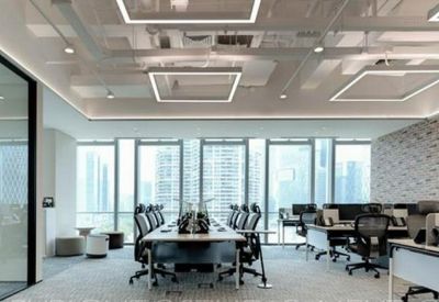 Large conference room with a long table and floor-to-ceiling city views.