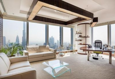 Executive office suite with cream sofas and panoramic views of the Burj Khalifa.