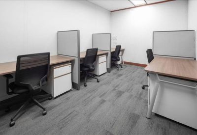 Private office suite with individual desks and partitions.