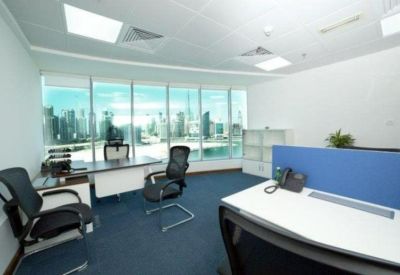 Private corner office featuring floor-to-ceiling windows with panoramic city views.