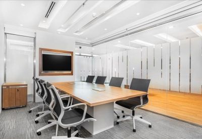 Vibrant breakout area featuring semi-private booths with colorful yellow and green padded walls.