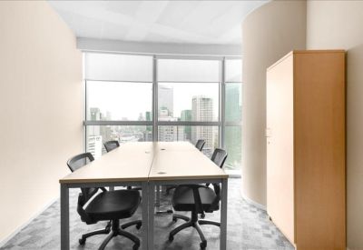 Four-person office suite with natural light and a storage cupboard.