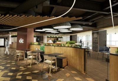 Spacious communal lounge featuring various seating options and a wood-paneled coffee bar.