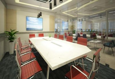 Contemporary meeting room featuring a white boardroom table and red ergonomic chairs.