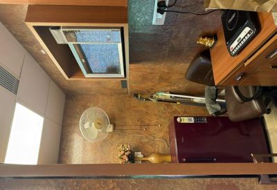 Small kitchenette area equipped with a microwave, refrigerator, and coffee station.