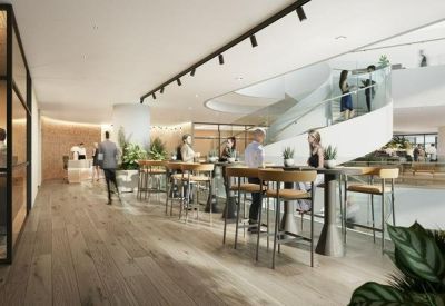 Modern workspace with high-top wooden tables, bar stools, and a sleek spiral staircase.