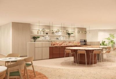 Contemporary office kitchen and breakout area with a large oval wooden island and bar seating.