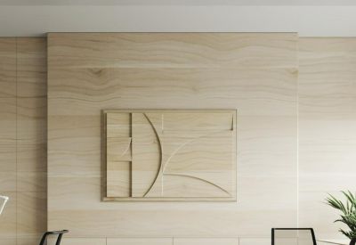 Bright workspace featuring a decorative wood-carved wall and ergonomic mesh chairs.