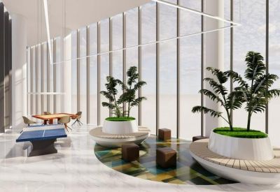 Spacious communal break area with indoor trees, a ping pong table, and floor-to-ceiling windows.