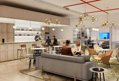 Modern cafe area featuring a white marble bar and contemporary gold chandeliers.