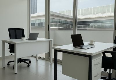 Modern two-person office suite featuring white desks and floor-to-ceiling windows.