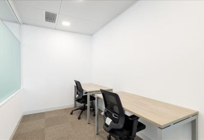 Private two-person internal office suite with minimal white walls.