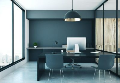 Private executive office with dark grey walls, glass partitions, and a large window.