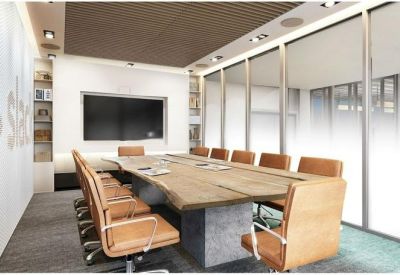 Professional conference room featuring a live-edge wooden table and tan leather chairs.