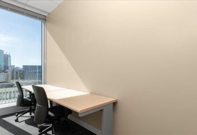 Bright two-person office suite with natural light and city views.