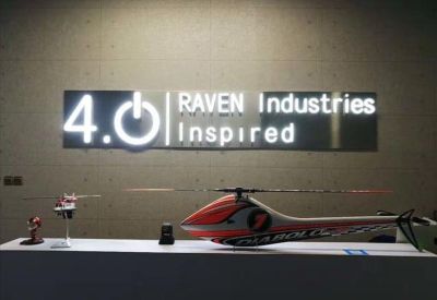 Company reception featuring Raven Industries signage and model helicopters on a display counter.
