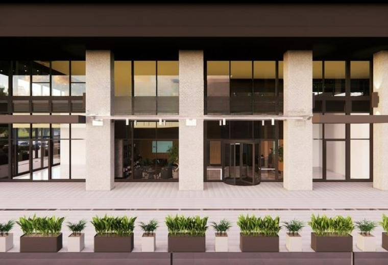Exterior view of the modern stone and glass facade at Nidya Center, Istanbul.