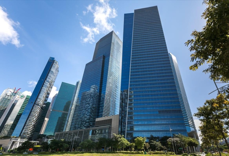 Exterior view of the soaring glass skyscrapers at 12 Marina Boulevard in the heart of the city.