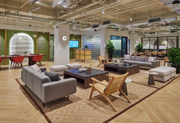 Spacious communal lounge at 108 Robinson Road with modern sofas, wooden floors, and exposed ceilings.