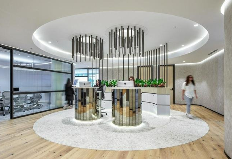 Modern lobby at 123 Pitt Street, Angel Place with circular lighting and mirrored reception pods.