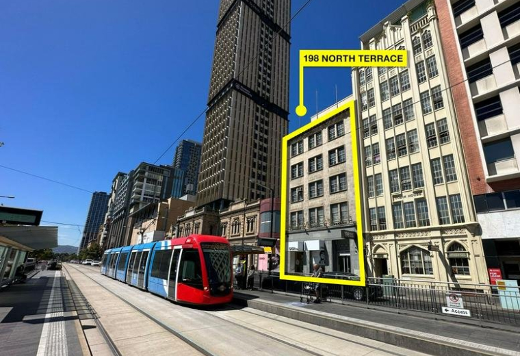 Exterior view of the multistory building at 198 North Terrace Adelaide near the city tram line.