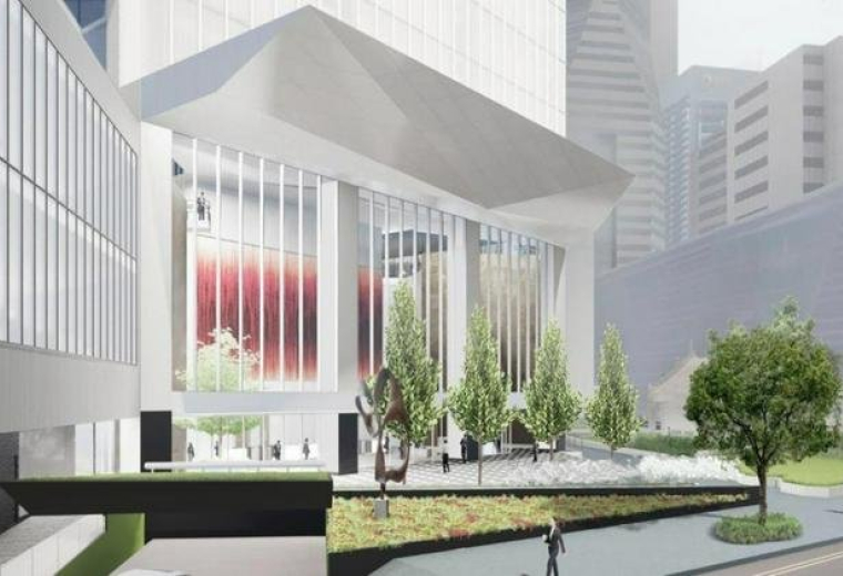 Exterior view of the modern glass entrance and geometric canopy of Singapore Land Tower.