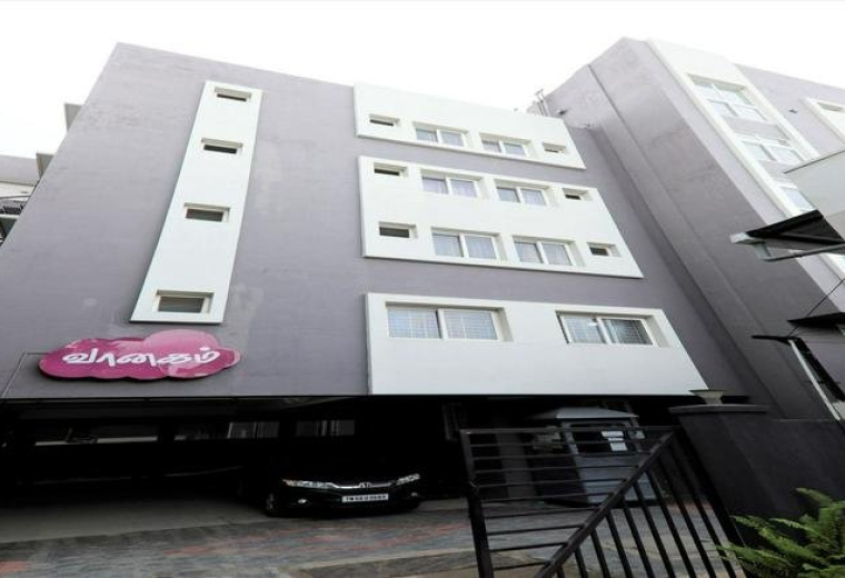 Exterior view of the multi-story building at 60, Vaanagam Road, Lakshmi Mills, Coimbatore.