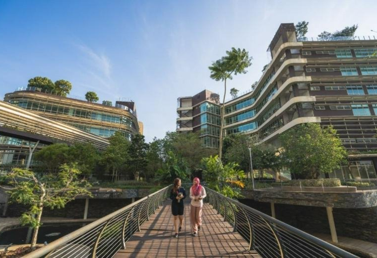 Exterior view of the multi-level glass and greenery-covered CIMB Leadership Academy.