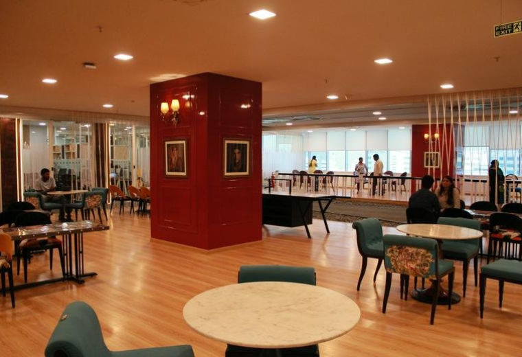 Spacious communal lounge and dining area at Cyber Crown, HUDA Techno Enclave, Madhapur, Hyderabad, India.
