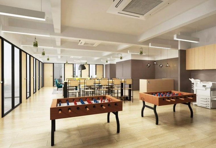 Spacious communal breakout area at Kwai Bo Industrial Building featuring foosball tables and natural light.