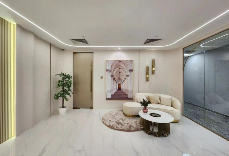 Spacious reception lounge at OCBC Centre with a white curved sofa and arched wall art.