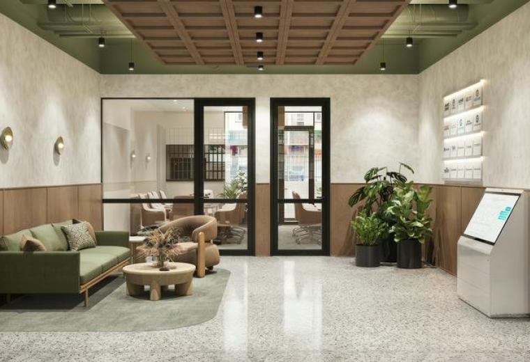 Lobby and reception lounge area at 116, Martin Street, Brighton featuring a green sofa and timber accents.