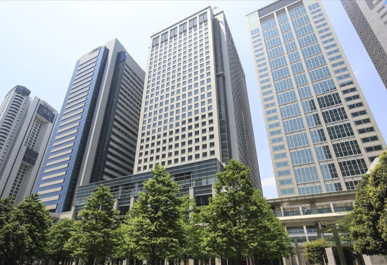 Exterior view of the soaring glass and stone facade at Shinagawa Grand Central Tower.