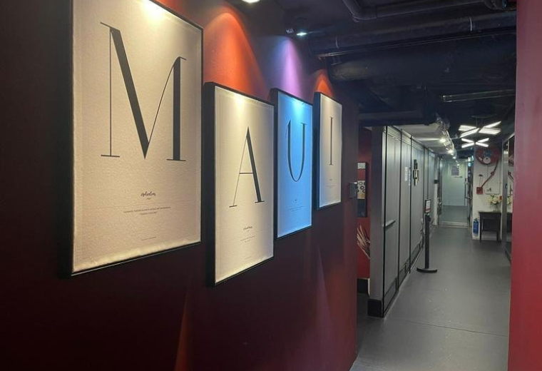 Entrance hallway at Eton Tower with large letter artwork and red accent walls.