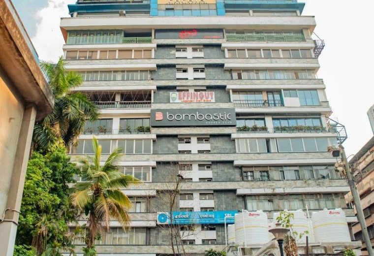 Exterior view of the green multi-story facade at 24, Park Street, Celica Park.