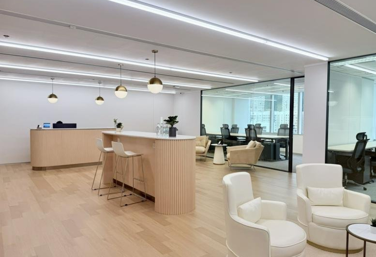 Spacious reception lounge at 27/F, 1111 King's Road, Taikoo Shing featuring warm wood floors and white seating.