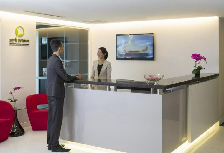 Bright reception desk at Park Avenue Rochester, 31 Rochester Drive, Buona Vista, Singapore with seating.