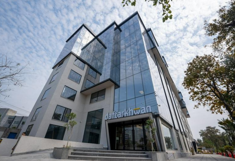 Exterior view of the modern glass-facade building at 34-S Main Boulevard, Block K, Gulberg.