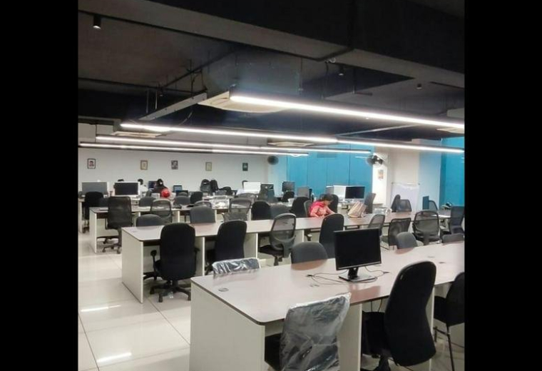 Spacious open-plan workspace at 496 G2, Grand CAG Central with modern overhead lighting and ergonomic chairs.