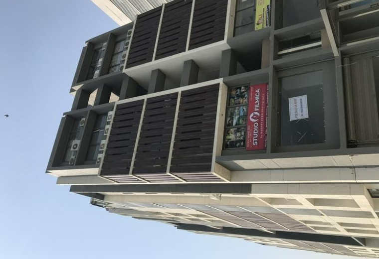 Exterior view of the modern multi-story commercial building facade at 501, Skywalk The Element.