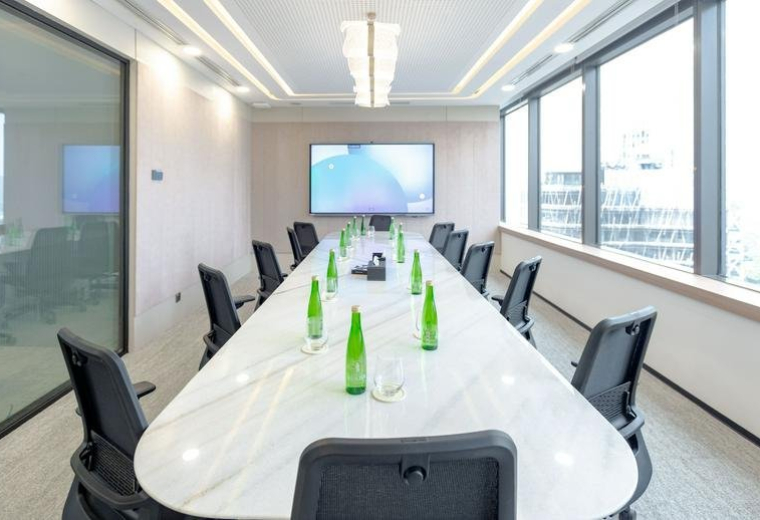Spacious boardroom with a large marble table and city views at 52-53, Jalan Jendral Sudirman kav 52-53.