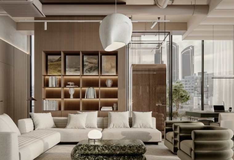 Interior view of a modern office lounge with a white sofa and green ottoman.