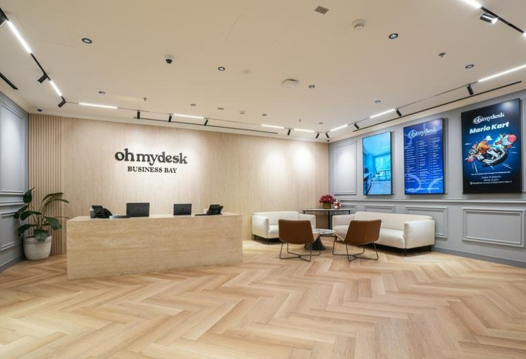 Spacious reception lobby of Baysquare Building 12 P Floor with stylish furniture and digital displays.
