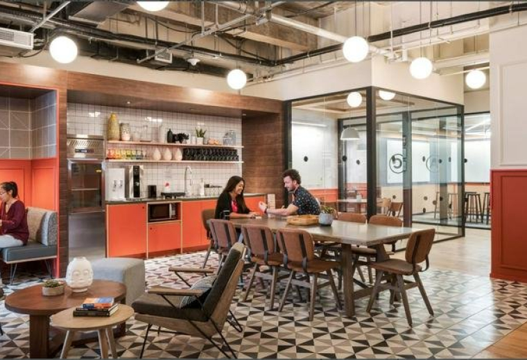 Spacious communal lounge at Cityplaza Three 18 Tai Koo Shing Road with a pantry and patterned tile flooring.