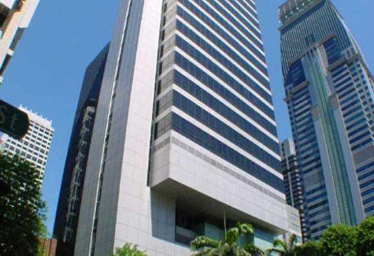 Exterior view of the towering glass-facade GB Building at 143 Cecil Street.
