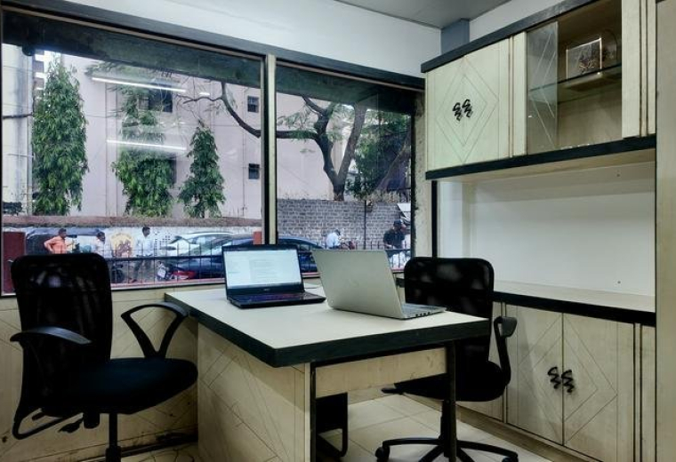 Private office with two workstations and a window view at Girish, 1156, Shukrawar Peth, Pune - 411002.